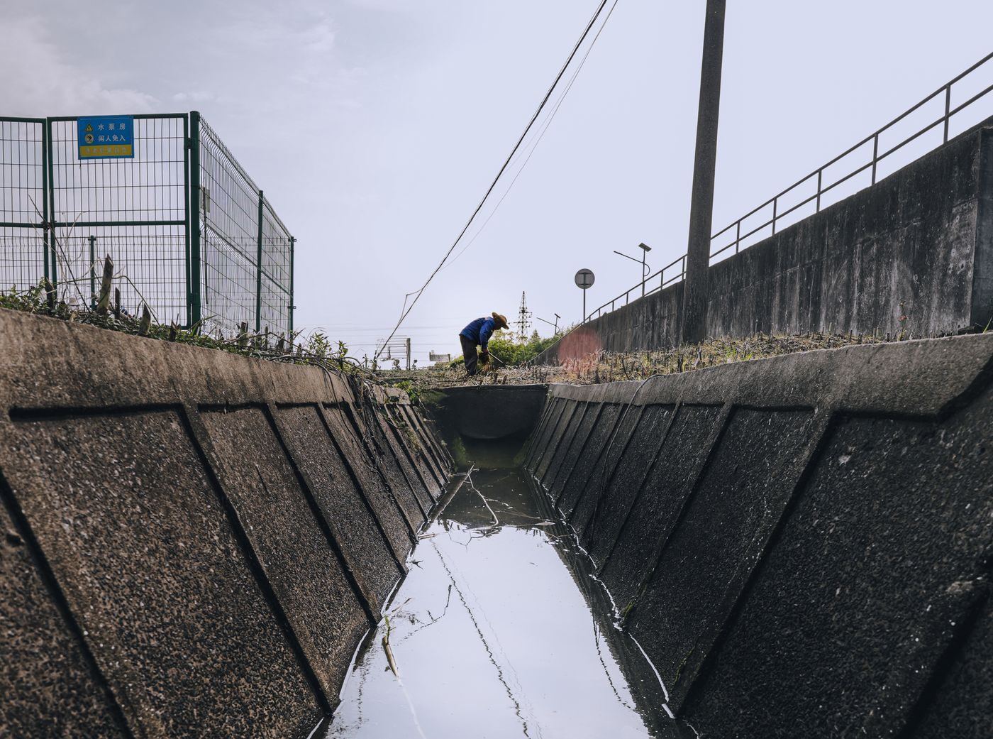 Precast concrete drainage channel laid along the edge of a site
