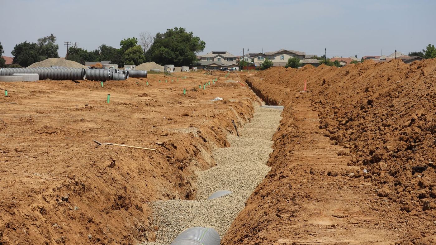 RC pipes and a drainage trench on a civil works site