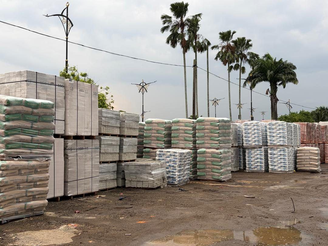 Pallets of cement and bagged goods stacked in the Sze Leong yard
