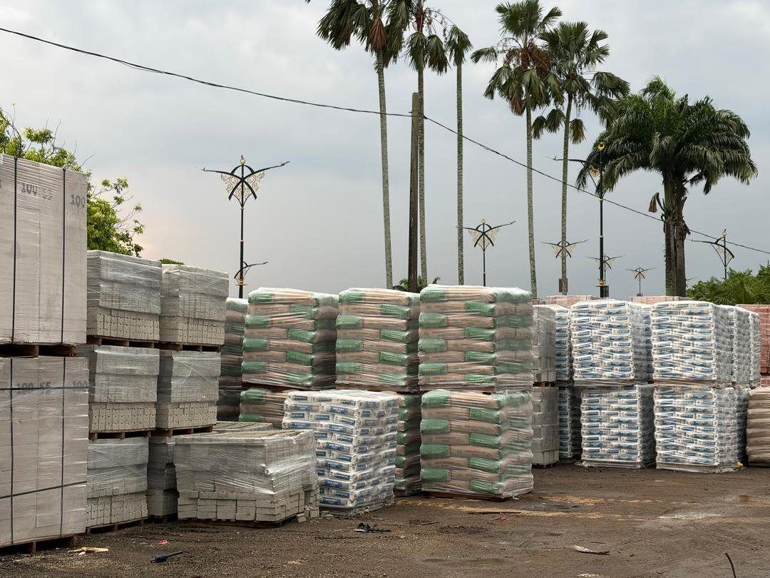 The Sze Leong materials yard stacked with cement, blocks and precast units